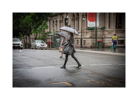 Two Walkers in the Rain